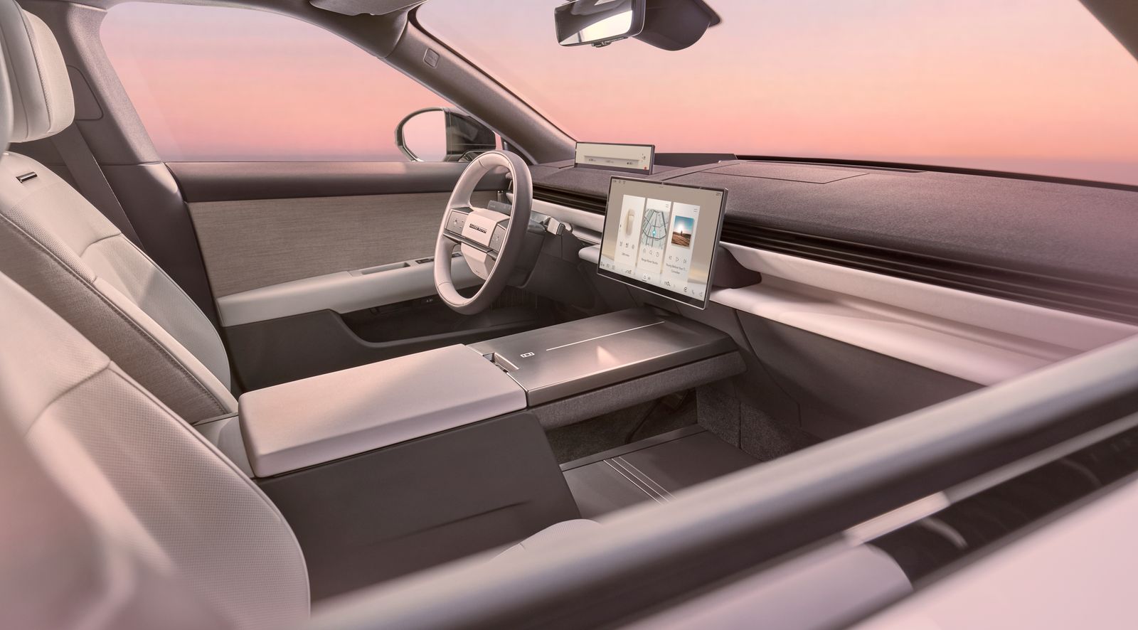 El interior minimalista del Range Rover GT presenta una pequeña pantalla para el conductor y una pantalla central ms...